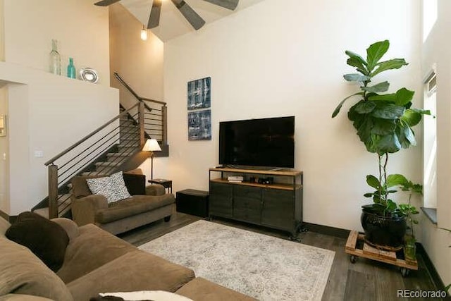 9768 Otis Dr, Westminster, CO 80021 - living area with a high ceiling, a ceiling fan, stairs, and wood finished floors