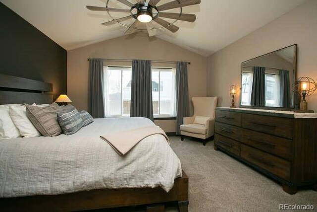 9768 Otis Dr, Westminster, CO 80021 - bedroom featuring a ceiling fan, lofted ceiling, and light colored carpet