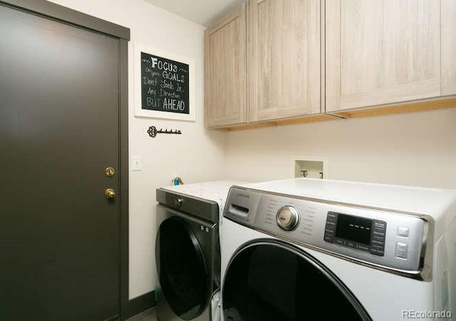 9768 Otis Dr, Westminster, CO 80021 - laundry room featuring separate washer and dryer and cabinet space