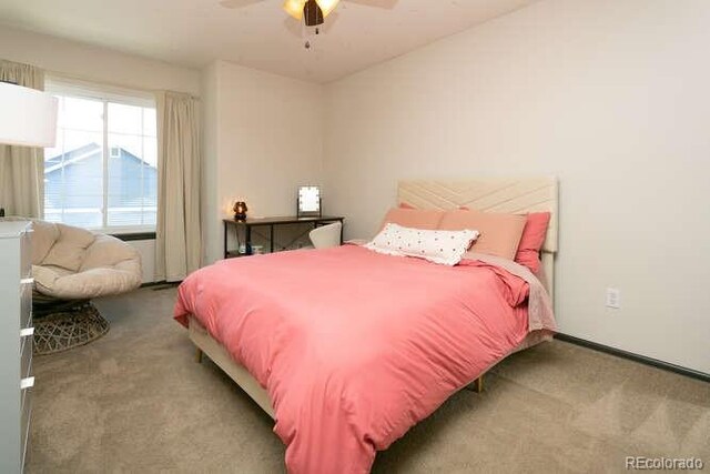 9768 Otis Dr, Westminster, CO 80021 - bedroom featuring baseboards, ceiling fan, and carpet flooring