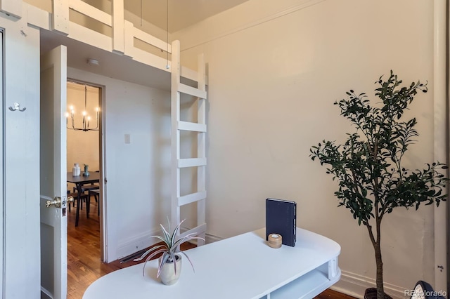 office with a chandelier, baseboards, and wood finished floors