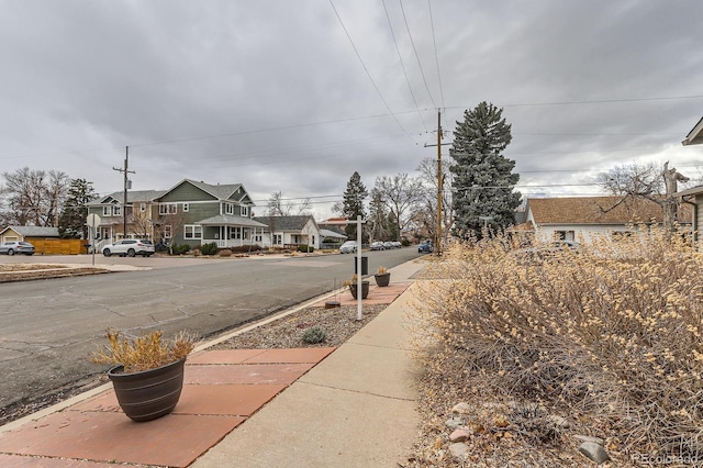 view of street featuring a residential view and sidewalks