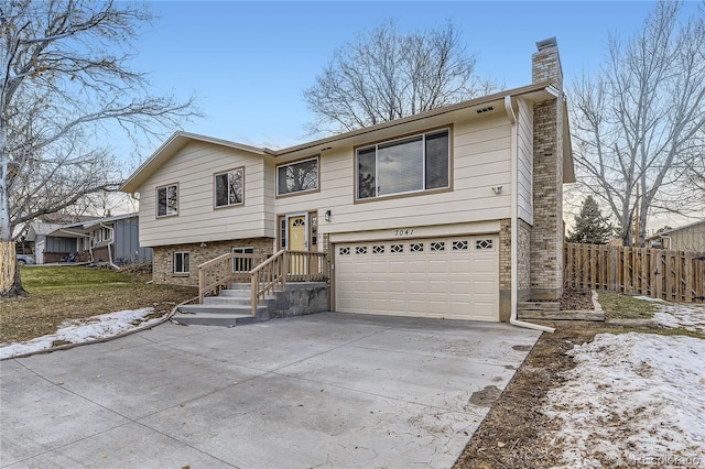 raised ranch featuring a garage