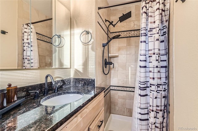 bathroom featuring a shower with shower curtain and vanity