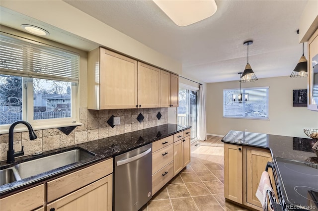 kitchen with dishwasher, hanging light fixtures, backsplash, light brown cabinetry, and range