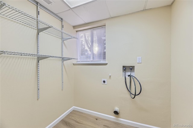 laundry area featuring hookup for an electric dryer, washer hookup, gas dryer hookup, and wood-type flooring