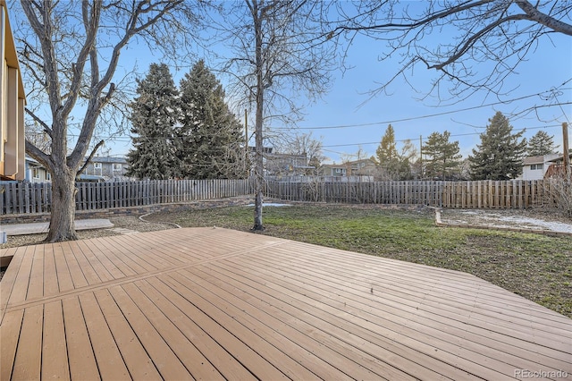 wooden terrace featuring a yard