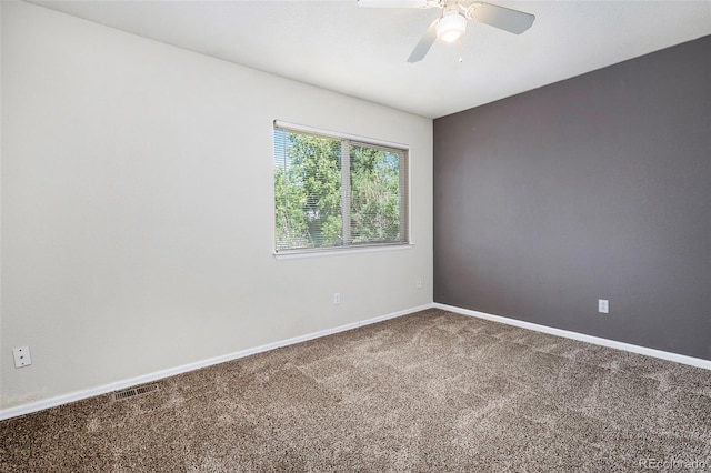 unfurnished room featuring carpet flooring and ceiling fan