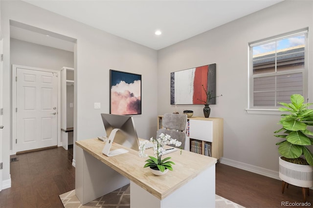 office with dark hardwood / wood-style floors