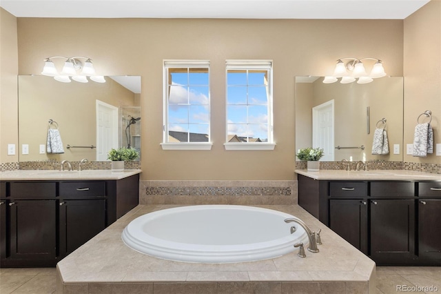 bathroom featuring separate shower and tub and vanity