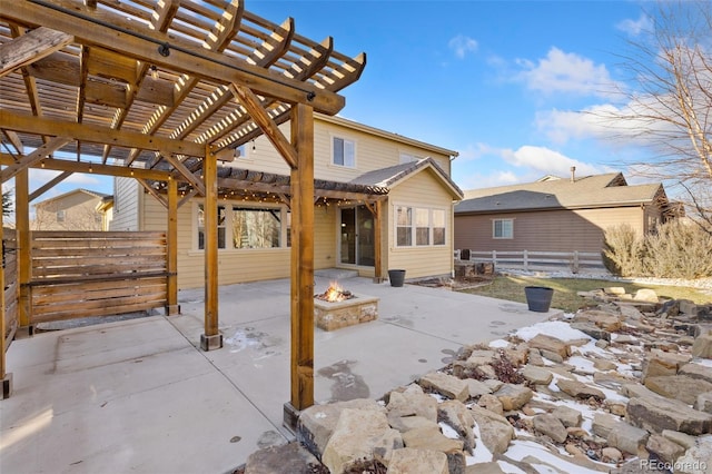 view of patio featuring an outdoor fire pit and a pergola