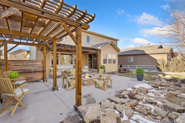 view of patio / terrace with a fire pit and a pergola