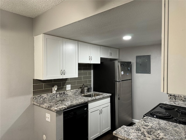 kitchen with black appliances, white cabinetry, and sink