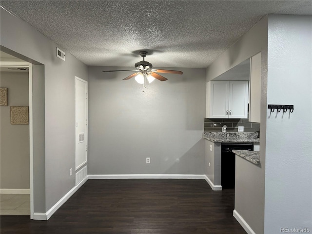 kitchen with ceiling fan, dishwasher, dark hardwood / wood-style flooring, a textured ceiling, and white cabinets