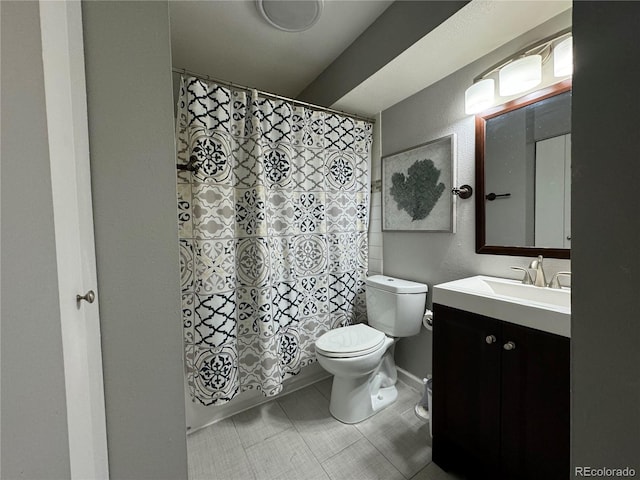 bathroom with tile patterned floors, vanity, and toilet