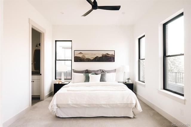 bedroom with light carpet, baseboards, and ceiling fan