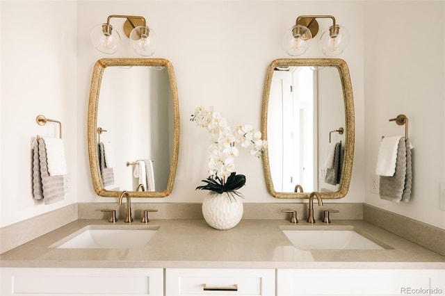 full bath with double vanity and a sink