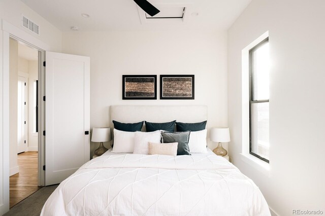 bedroom with a ceiling fan and visible vents