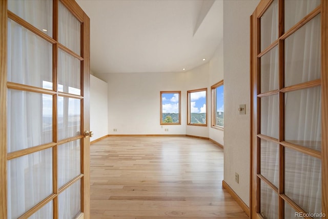 23007 Big Game Trl, Conifer, CO 80433 - spare room featuring light wood finished floors, french doors, baseboards, and recessed lighting