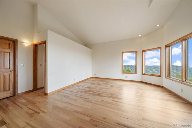 23007 Big Game Trl, Conifer, CO 80433 - unfurnished room with light wood-style floors, baseboards, recessed lighting, and high vaulted ceiling