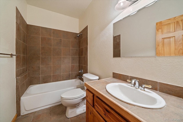 23007 Big Game Trl, Conifer, CO 80433 - bathroom featuring a textured wall, toilet, shower / bathtub combination, vanity, and tile patterned flooring