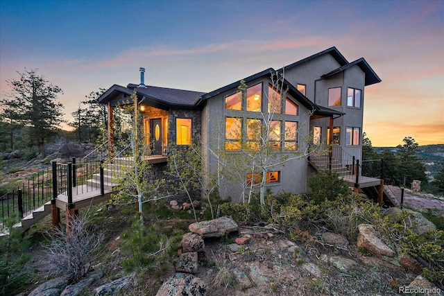 23007 Big Game Trl, Conifer, CO 80433 - view of front of property featuring stairs, stone siding, and stucco siding