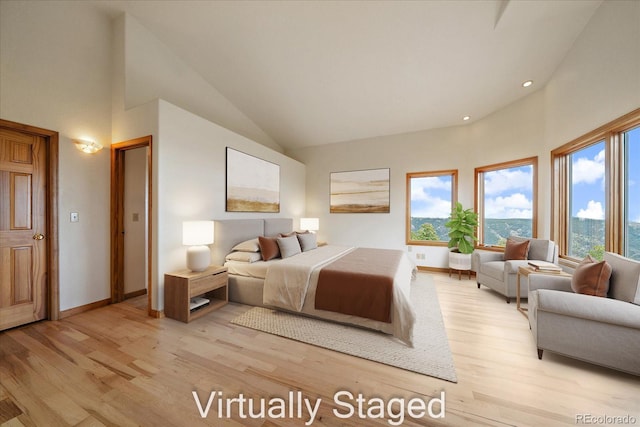 23007 Big Game Trl, Conifer, CO 80433 - bedroom with light wood finished floors, baseboards, high vaulted ceiling, and recessed lighting