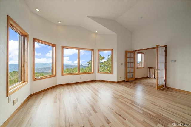 23007 Big Game Trl, Conifer, CO 80433 - empty room featuring light wood-style floors, baseboards, recessed lighting, and high vaulted ceiling