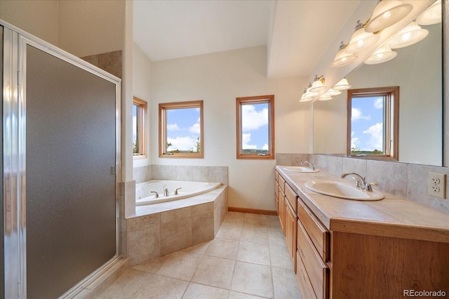 23007 Big Game Trl, Conifer, CO 80433 - bathroom featuring a garden tub, a shower stall, tile patterned floors, and double vanity