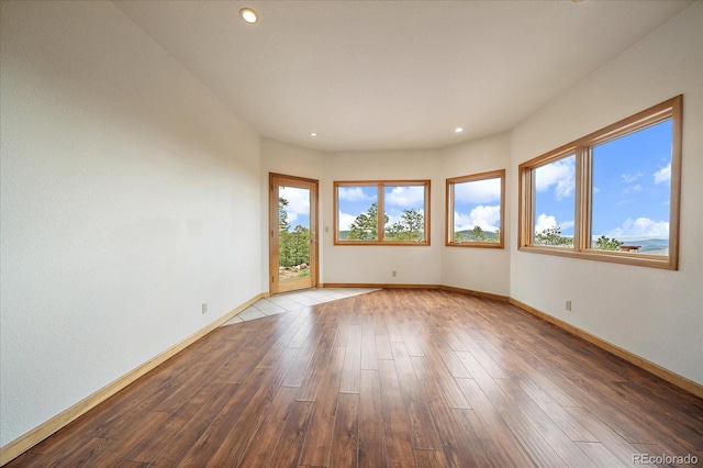 23007 Big Game Trl, Conifer, CO 80433 - empty room featuring baseboards, hardwood / wood-style flooring, and recessed lighting