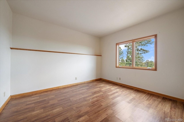 23007 Big Game Trl, Conifer, CO 80433 - spare room featuring wood finished floors and baseboards