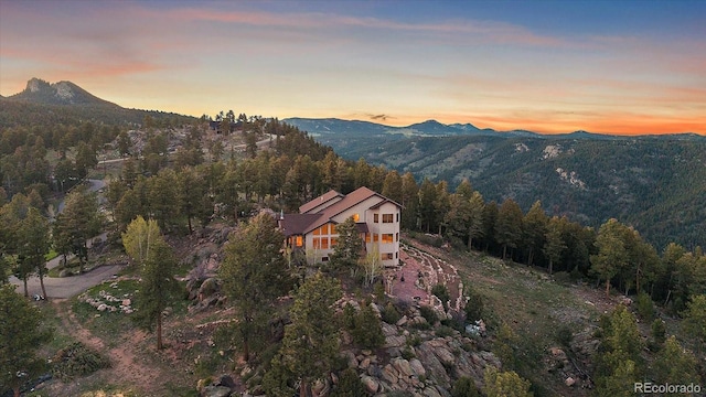 23007 Big Game Trl, Conifer, CO 80433 - view of mountain background featuring a heavily wooded area