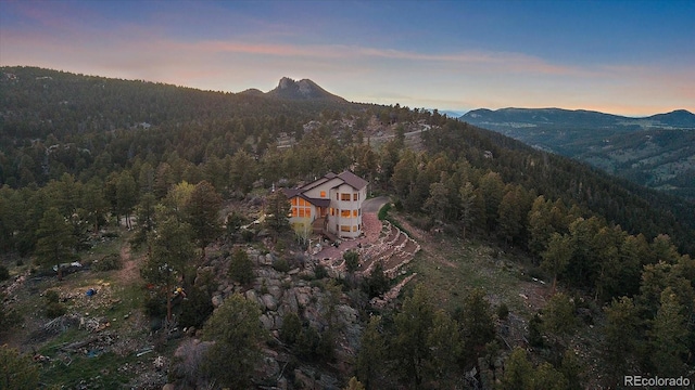 23007 Big Game Trl, Conifer, CO 80433 - mountain view featuring a heavily wooded area