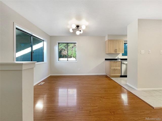 unfurnished dining area featuring light hardwood / wood-style floors