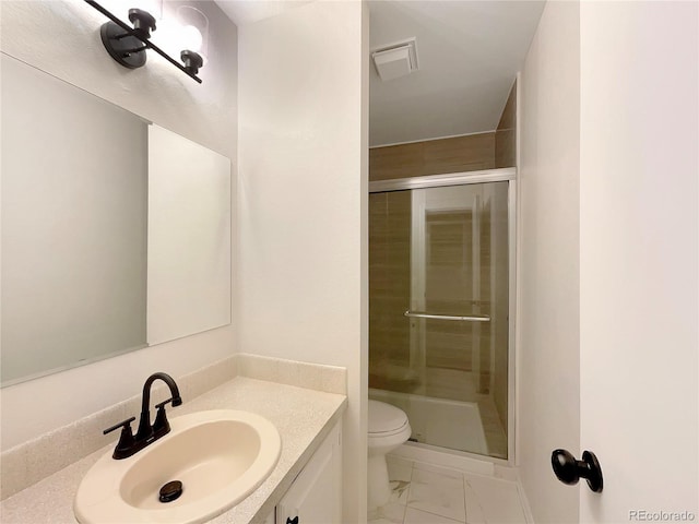 bathroom featuring vanity, toilet, and walk in shower