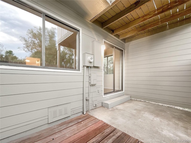 wooden deck with a patio area