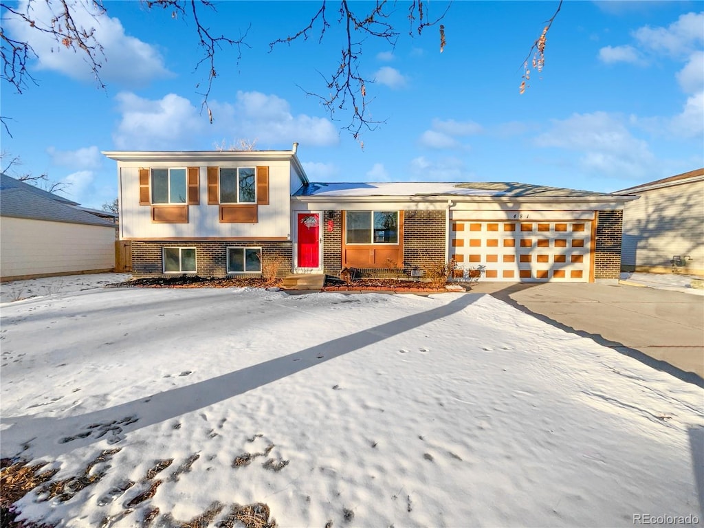 split level home with a garage