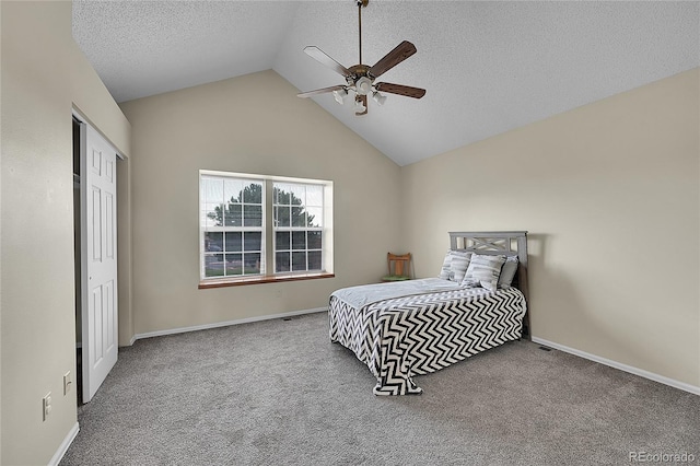 6737 Overland Dr, Colorado Springs, CO 80919 - carpeted bedroom with baseboards, vaulted ceiling, and a textured ceiling