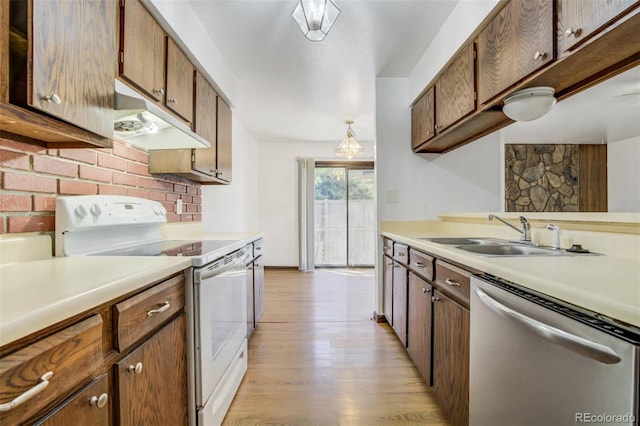 15157 E Louisiana Dr Unit A, Aurora, CO 80012 - kitchen featuring stainless steel dishwasher, electric stove, under cabinet range hood, light countertops, and light wood-type flooring