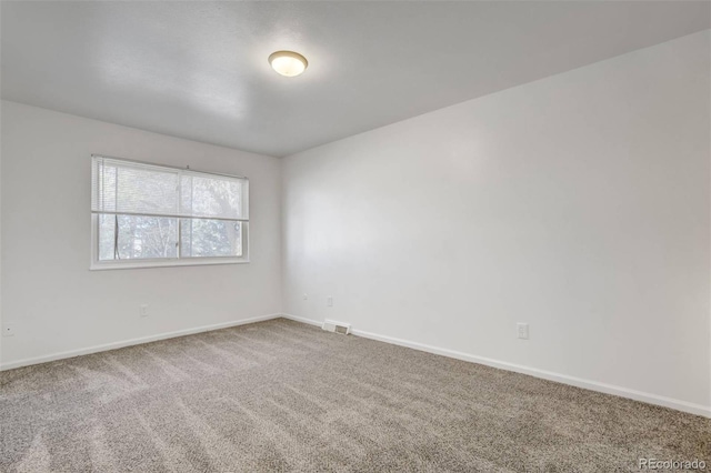 15157 E Louisiana Dr Unit A, Aurora, CO 80012 - carpeted spare room featuring baseboards