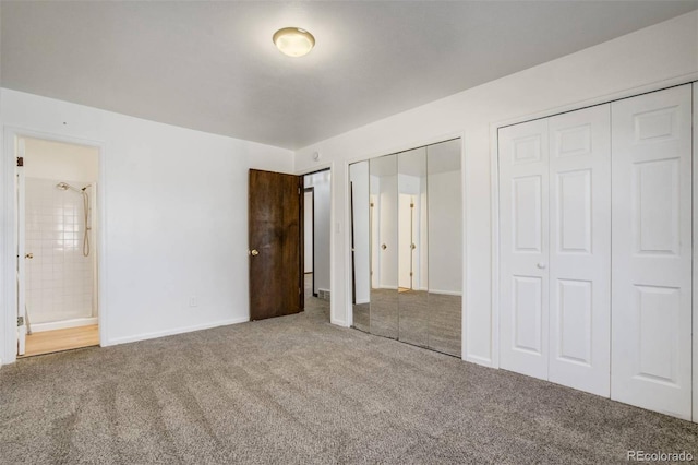 15157 E Louisiana Dr Unit A, Aurora, CO 80012 - unfurnished bedroom with carpet flooring, multiple closets, and connected bathroom