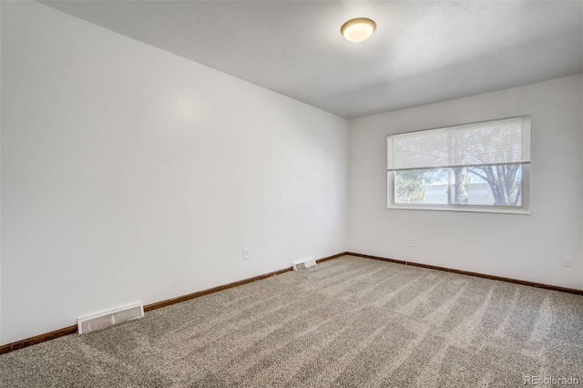 15157 E Louisiana Dr Unit A, Aurora, CO 80012 - spare room featuring carpet flooring
