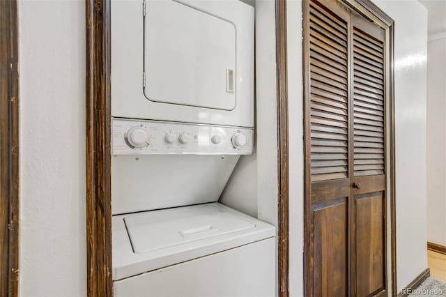 15157 E Louisiana Dr Unit A, Aurora, CO 80012 - washroom featuring estacked washer and dryer