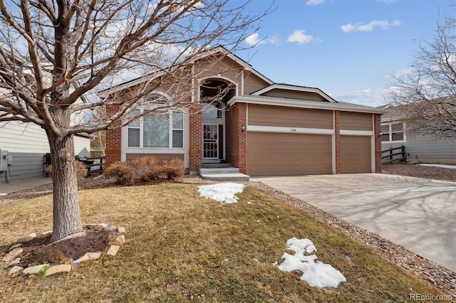 view of front of house featuring a front yard, concrete driveway, brick siding, and an attached garage