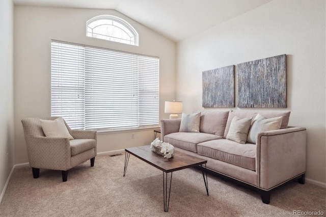 carpeted living room with vaulted ceiling, visible vents, and baseboards