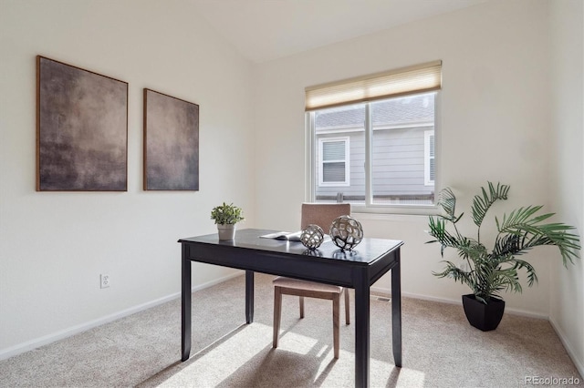 carpeted office featuring baseboards