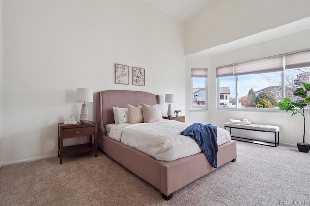 bedroom featuring high vaulted ceiling, carpet flooring, and baseboards