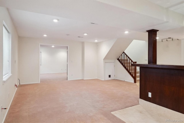 bonus room featuring baseboards, stairway, recessed lighting, and light colored carpet