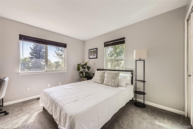7792 Garrison Ct, Arvada, CO 80005 - carpeted bedroom featuring baseboards