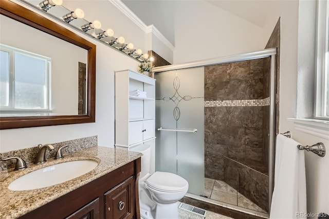 7792 Garrison Ct, Arvada, CO 80005 - full bathroom featuring toilet, vanity, a stall shower, and crown molding